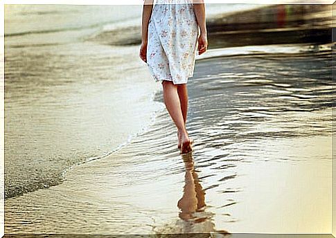 Woman walking on the beach couple relaxing