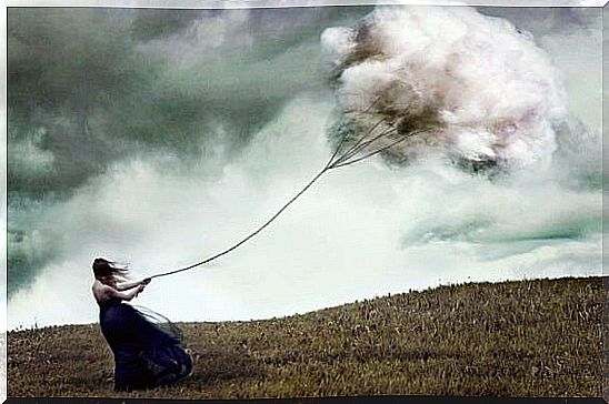 girl dragging cloud symbolizing the factors that damage the relationship with yourself