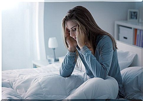 Woman with sleep problems in bed