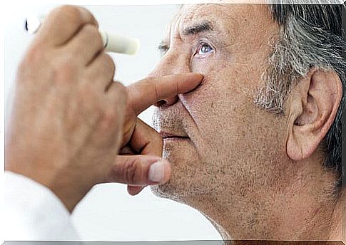 Ophthalmologist checking his patient's vision to assess the cataract operation