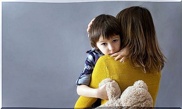 child in the arms of his depressed mother