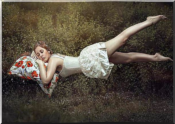 Woman leaning on a cushion between dreams and the unconscious