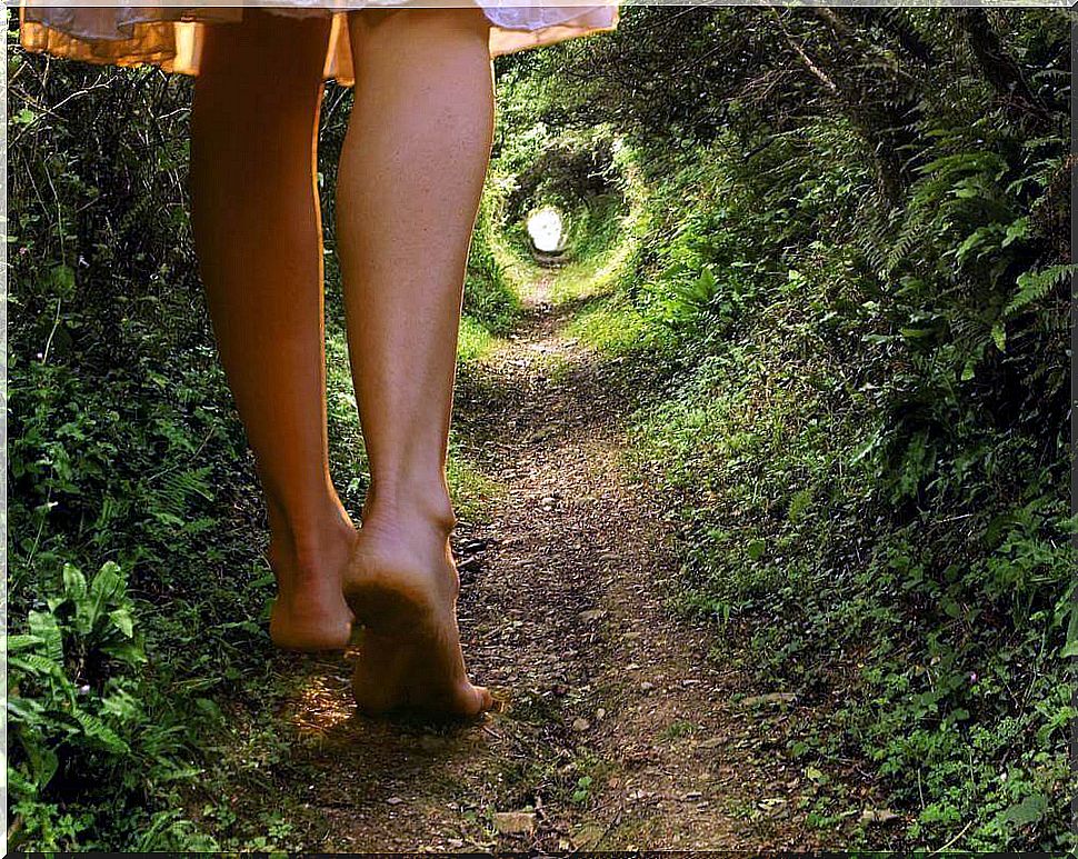 Woman walking down a path