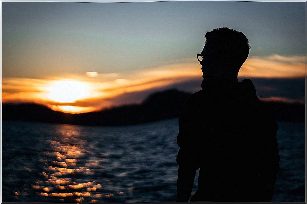 boy before the sea thinking about how to have compassion for oneself