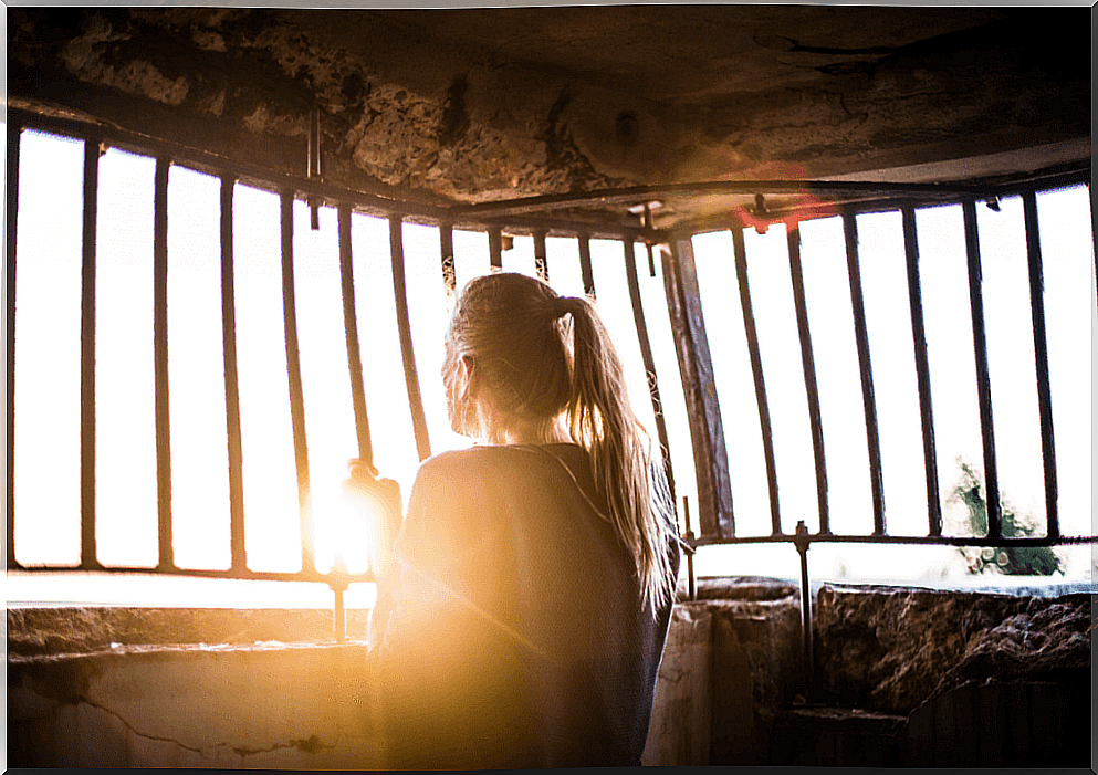 Woman looking out the window