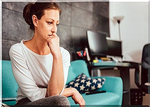 Worried woman in living room