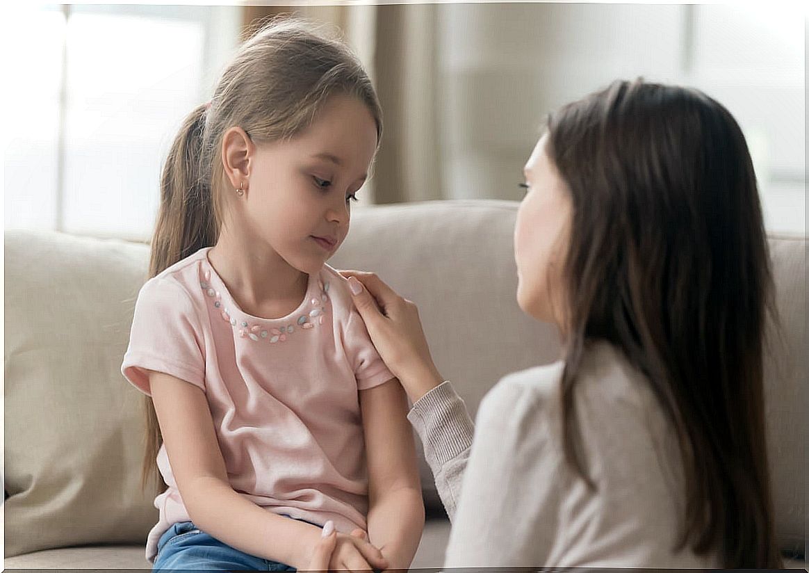 Little daughter talking to her mother