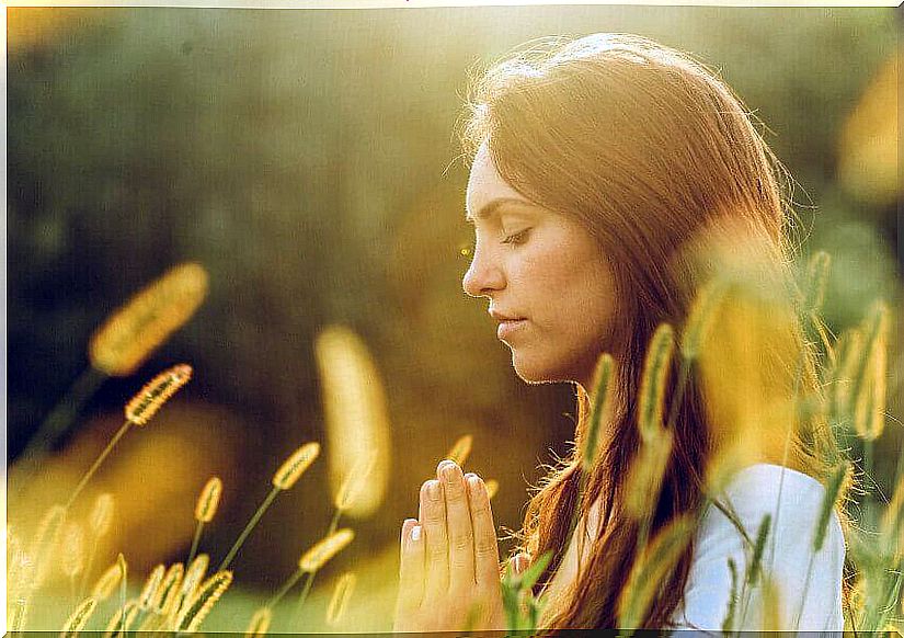 Woman with eyes closed meditating