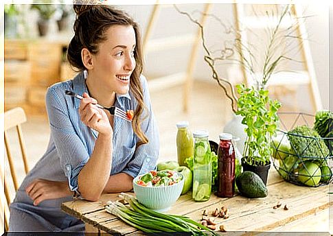 Woman eating salad