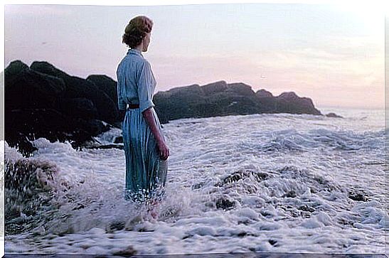 Woman thinking about the effects of the sea and health for her well-being