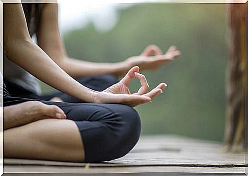 People meditating outdoors