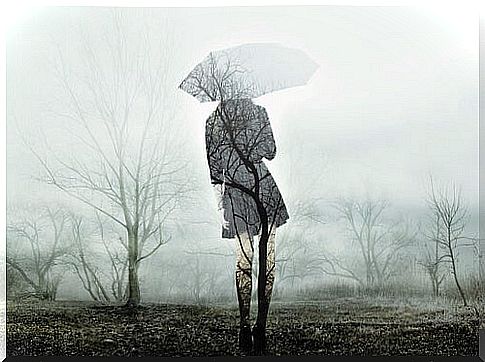 Woman with an umbrella wrapped in melancholy symbolizing the story of Joanne Greenberg