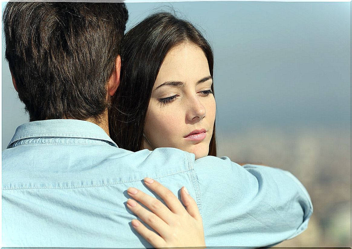 Boy hugging his worried girlfriend