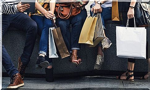 Friends with many shopping bags